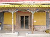 Tibet Guge 07 Tsaparang Red Temple 01 Outside Tsaparang�s Red Temple (Lhakhang Marpo) was built around 1470, perhaps 30 years earlier than the White Temple. The murals in this 16m x 20m chapel were repainted around 1630, shortly before the fall of the Guge kingdom. The main statue of Shakyamuni was built of gilded bronze, but alas lays in rubble, destroyed by the Chinese Red Guards.